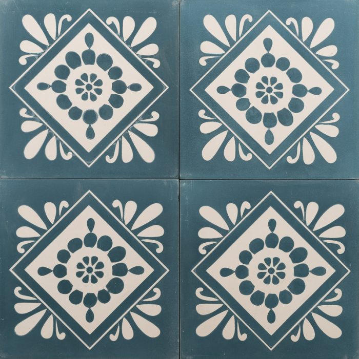 Deep blue tile with a white floral design