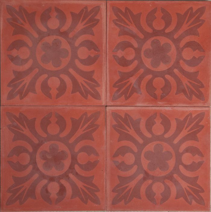 a red tile with a mandala pattern